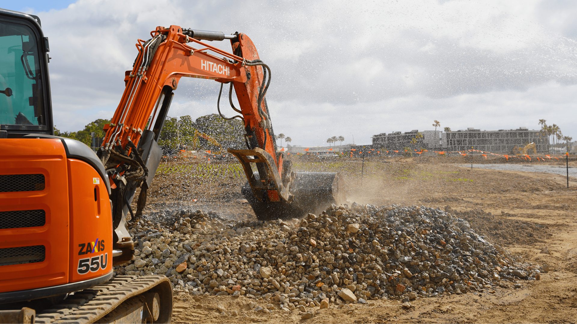 Excavator loading a tipper on site